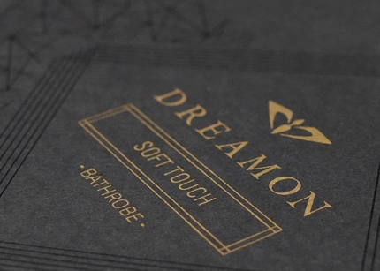 Classic gold silkscreen print adds luxury to dark packaging.